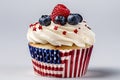 American vanilla sweet cupcake in color USA flag on white background. Food for Patriotic Independence Day 4th of july.