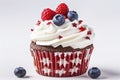 American vanilla sweet cupcake in color USA flag on white background. Food for Patriotic Independence Day 4th of july.