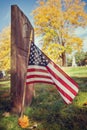 American veteran flag in autumn cemetery Royalty Free Stock Photo