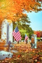 American veteran flags in autumn cemetery Royalty Free Stock Photo