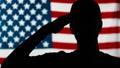 American veteran salutes. Close up silhouette