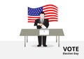 American voter with medical mask to prevent Covid-19 corona virus voting to ballot drop box for election day campaign