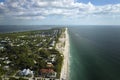 American waterfront houses in rural US suburbs. View from above of large residential homes in island small town Boca