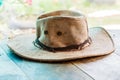 American West rodeo cowboy felt hat and authentic leather western riding boots with vintage ranching gear