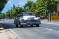 American white classic convertible car drive on the street in Varadero Cuba - Serie Cuba Reportage