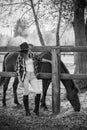 American woman on a rancho with a horse, hippotherapy