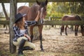 American woman on a rancho with a horse, hippotherapy Royalty Free Stock Photo