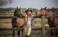 American woman on a rancho with a horse, hippotherapy