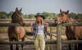 American woman on a rancho with a horse, hippotherapy