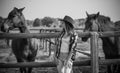 American woman on a rancho with a horse, hippotherapy