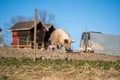 American Yorkshire pig mother with its piglets on the farm, sunlit grass, farm and sky background Royalty Free Stock Photo