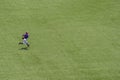 American youth baseball player running on field