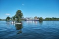 Amersfoort, Hoogland, the Netherlands June 13, 2021, Bicycle boat, ferry eemland on the river Eem with canoeist and a Royalty Free Stock Photo