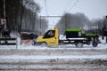 Amersfoort, the Netherlands, Feb,7,2021:Snowplow truck removing dirty snow and sprinkle salt against slipperiness on Royalty Free Stock Photo