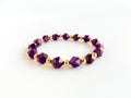Amethyst Bracelet with Gold Filled Spacer Beads Isolated on White Royalty Free Stock Photo