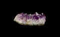 Amethyst cluster isolated on black, side view