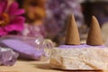 Amethyst Crystals With Flowers and Incense Cones on Meditation Table Royalty Free Stock Photo