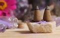 Amethyst Crystals With Flowers and Incense Cones on Meditation Table Royalty Free Stock Photo