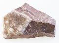 amethyst crystals on raw rock on white