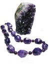 Amethyst geode crystals and jewelery beads Royalty Free Stock Photo