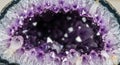 Amethyst geode interior with sharp, purple crystals forming a cavity. The crystals Royalty Free Stock Photo