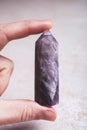 Amethyst mineral stone in female hand