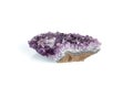 Amethyst mineral stone macro on white background