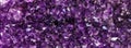 Amethyst purple crystal. Mineral crystals in the natural environment. Texture of precious and semiprecious gemstone.