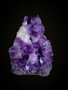 Amethyst stone. Precious violet variety of quartz. On a black background. Royalty Free Stock Photo