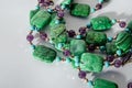 Amethyst, turquoise and crazy agate necklace on white background Royalty Free Stock Photo