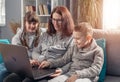 Amicable family using laptop together