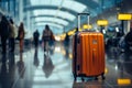 Amid the airport\'s commotion, a luggage bag blends into the blurred setting