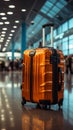 Amid the airport\'s commotion, a luggage bag blends into the blurred setting