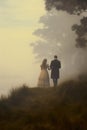 victorian historical couple walking in love down a foggy path.