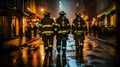 Firefighters extinguish a fire in the city at night. Selective focus