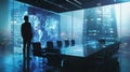 Amidst a high-tech office environment, a businessman analyzes complex data on a vast digital wall, symbolizing the intersection of Royalty Free Stock Photo