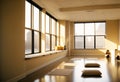 empty yoga studio at sunset, with warm, golden light streaming in through the windows (AIgen) Royalty Free Stock Photo