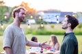 Heartfelt Conversations: Friends at Evening Garden Party