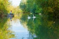 Amiens France fisherman and swans in a canal