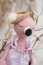 Amigurumi toy. Sleeping pink flamingos