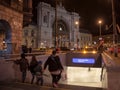 Amily going down the stairs of a metro Station in front of Budapest Keleti Palyaudvar train station at night Royalty Free Stock Photo