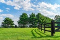 Amish country field agriculture, beautiful brown wooden fence, farm, barn in Lancaster, PA US Royalty Free Stock Photo