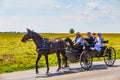 Amish Family in Black Wagon