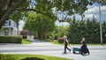 An Amish Family Walking along a Country Road Pulling a Wagon Royalty Free Stock Photo