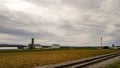 An Amish farm with barns and silo on a cloudy day. Royalty Free Stock Photo