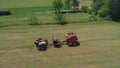 Amish Farmer Harvesting His Crop with 4 Horses and Modern Equipment Royalty Free Stock Photo