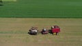 Amish Farmer Harvesting His Crop with 4 Horses and Modern Equipment Royalty Free Stock Photo