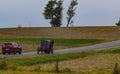 Amish Horse and Buggy Going Up a Hill