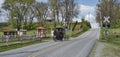 Amish Horse and Buggy Traveling Along a Countryside Road Thru Farmlands