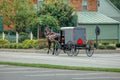 Amish Horse and Buggy Trotting to Country Store Royalty Free Stock Photo